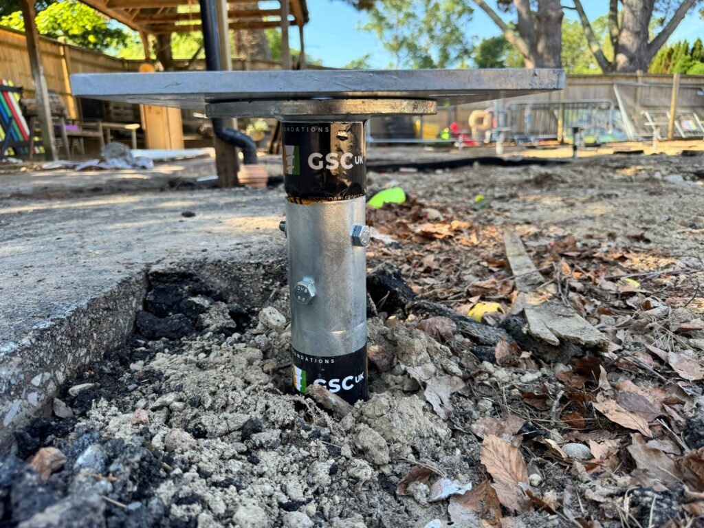 Installing ground screws for a modular classroom