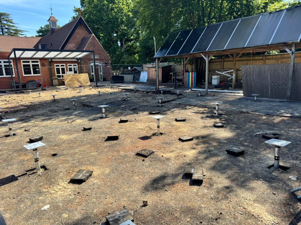 Installing ground screws for a modular classroom