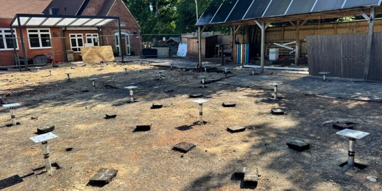 Installing ground screws for a modular classroom